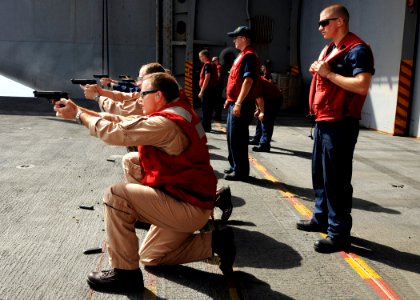 US Navy 080624-N-9898L-001 Capt. Patrick Hall, foreground, commanding officer of Nimitz-class aircraft carrier USS Abraham Lincoln (CVN 72), and Lincoln's Executive Officer, Capt. Jeffrey Ruth, take part in small arms familiari