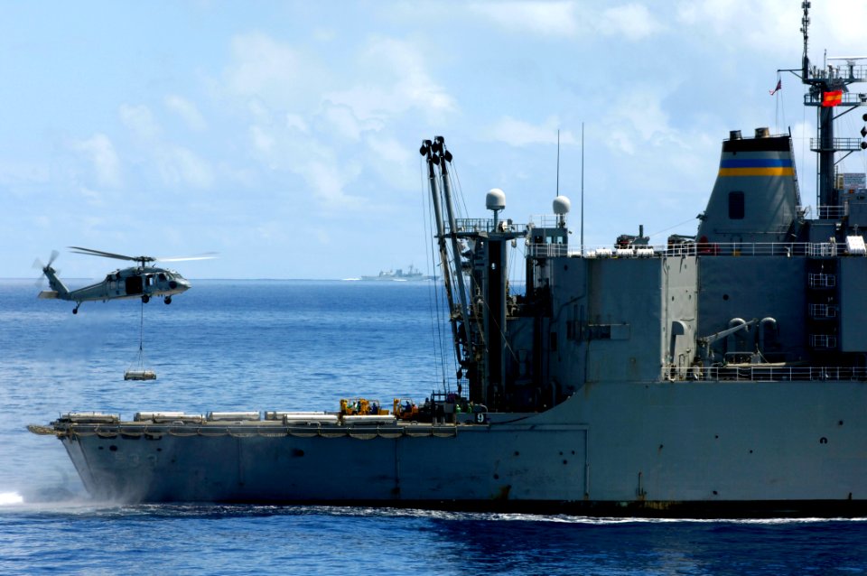US Navy 080620-N-7883G-189 An MH-60S Seahawk transfers ammunition from the aircraft carrier USS Kitty Hawk (CV 63) to the the Military Sealift Command ammunition ship USNS Shasta (T-AE 33)