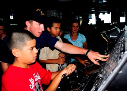 US Navy 080624-N-5067K-076 Seaman Craig R. Murphy, from Savannah, Tenn., instructs visiting family members or