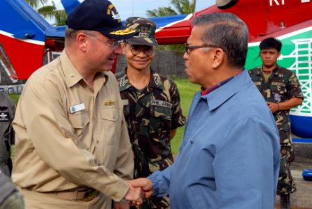US Navy 080625-N-0640K-026 Rear Adm. James P. Wisecup, left, shakes hands with Angelo Reyes, Secretary of Energy for the Republic of the Philippines