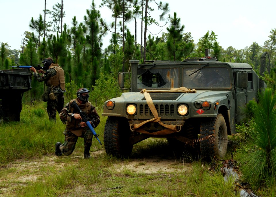 US Navy 080624-N-1120L-013 Seabees assigned to Naval Mobile Construction Battalion (NMCB) 7's convoy security element (CSE) teams move to secure a simulated vehicle in distress