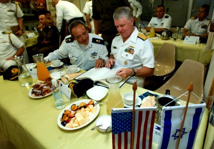 US Navy 080621-N-8273J-215 Chief of Naval Operations (CNO) Adm. Gary Roughead signs the guest book while aboard the Eilat-class corvette INS Lavhav (SAAR 502) photo