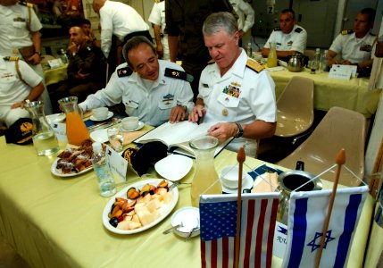 US Navy 080621-N-8273J-215 Chief of Naval Operations (CNO) Adm. Gary Roughead signs the guest book while aboard the Eilat-class corvette INS Lavhav (SAAR 502)