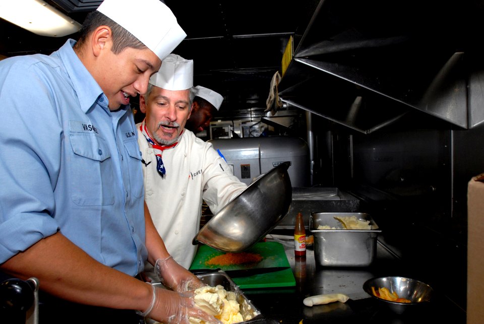US Navy 080625-N-0841E-033 Former Top Chef contestant, Otto Borsich, lends a hand preparing a meal during a recent visit to the amphibious transport dock ship USS San Antonio (LPD 17)
