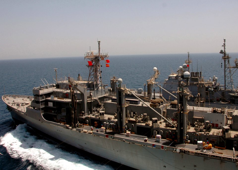 US Navy 080623-N-6736G-260 The Military Sealift Command fast combat support ship USNS Rainer (T-AOE 7) and the Ticonderoga-class Cruiser USS Capt St. George (CG 72) pull alongside the Nimitz-class aircraft carrier USS Abraham L
