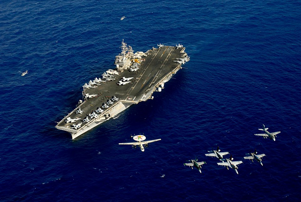 US Navy 080623-N-7883G-274 PACIFIC OCEAN (June 23, 2008) Aircraft assigned to Carrier Air Wing (CVW) 5 fly in formation above the aircraft carrier USS Kitty Hawk (CV 63)