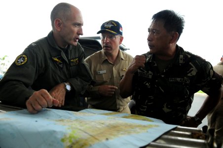US Navy 080626-N-4009P-040 Rear Adm. James P. Wisecup, Brig. Gen. Jorge Segovia, and Capt. Thomas P. Lalor discuss the current relief efforts