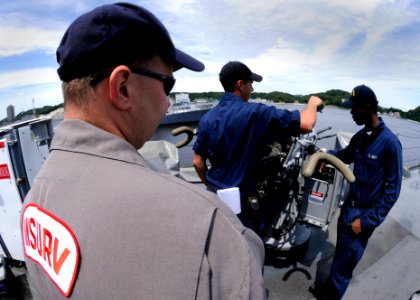 US Navy 080624-N-8546L-027 oard of Inspection and Survey (INSURV) inspector Lt. Cmdr. Michael Kalinski evaluates the material condition of the amphibious command ship USS Blue Ridge (LCC 19) combat systems equipment