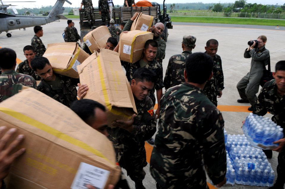 US Navy 080627-N-3659B-259 Members of the Armed Forces of the Philippines (AFP) work hand-in-hand with Ronald Reagan Carrier Strike Group Sailors