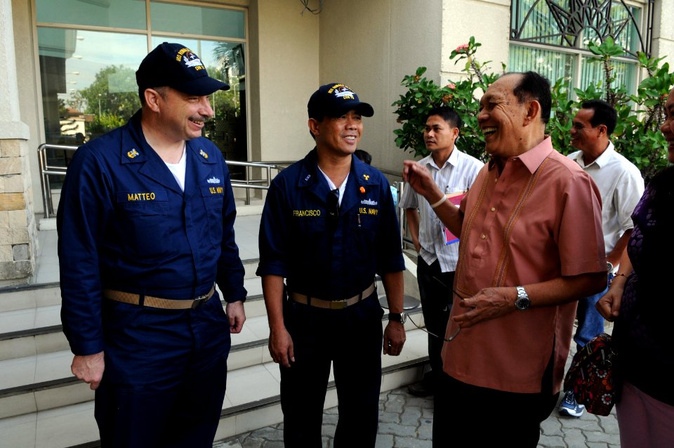 US Navy 080627-N-3659B-312 Master Chief Engineman Joseph Matteo, left, and Chief Warrant Officer Zosimo Francisco meet with Neil Tupas, governor of Iloilo, prior to troubleshooting and repairing generators at hospitals througho