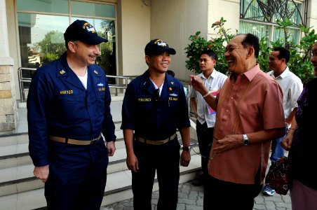 US Navy 080627-N-3659B-312 Master Chief Engineman Joseph Matteo, left, and Chief Warrant Officer Zosimo Francisco meet with Neil Tupas, governor of Iloilo, prior to troubleshooting and repairing generators at hospitals througho