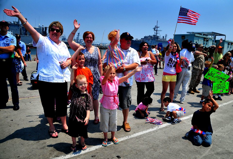 US Navy 080626-N-4774B-626 Family members and friends greet Sailors aboard the amphibious assault ship USS Boxer (LHD 4) as they return from performing in mission Continuing Promise (CP) 2008