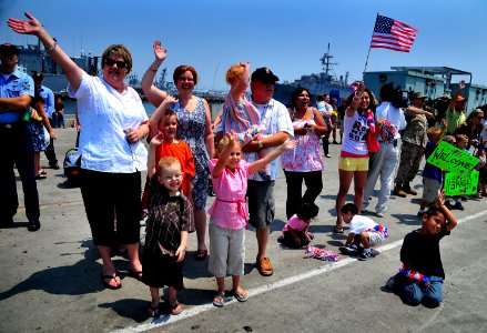 US Navy 080626-N-4774B-626 Family members and friends greet Sailors aboard the amphibious assault ship USS Boxer (LHD 4) as they return from performing in mission Continuing Promise (CP) 2008