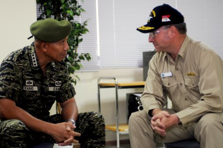 US Navy 080627-N-3659B-645 Armed Forces of the Philippines (AFP) Chief of Staff Gen. Alexander B. Yano and Rear Adm. James P. Wisecup, commander, Carrier Strike Group (CSG) 7, discuss the progress and plans for future clean up