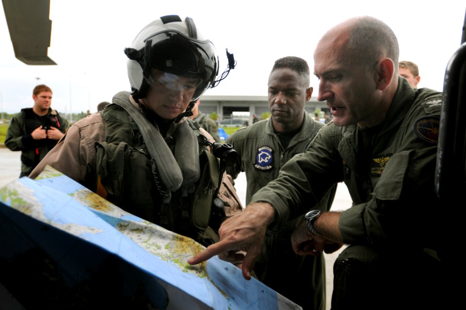 US Navy 080626-N-5961C-012 Capt. Thomas P. Lalor, right, deputy commander, Carrier Air Wing (CVW) 14, gives Lt. Ralph Silvas directions to the area he is to deliver humanitarian supplies to on Panay Island