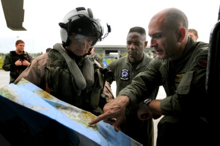 US Navy 080626-N-5961C-012 Capt. Thomas P. Lalor, right, deputy commander, Carrier Air Wing (CVW) 14, gives Lt. Ralph Silvas directions to the area he is to deliver humanitarian supplies to on Panay Island