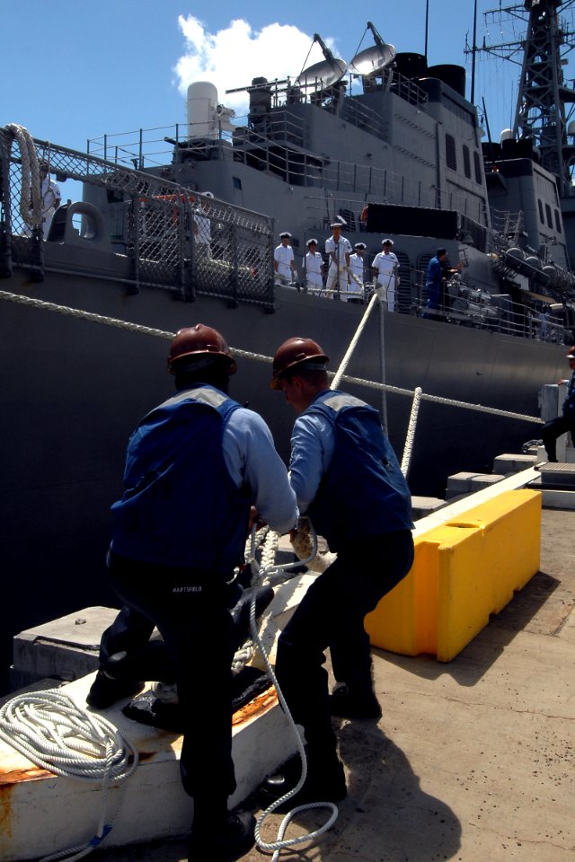 US Navy 080626-N-9500T-302 Aviation Ordnanceman Airman Thomas Harman, left, and Aviation Boatwain's Mate Seaman Steven Becker secure the mooring lines of the Japanese Maritime Self-Defense Force Ship Kirishima (DD 174)