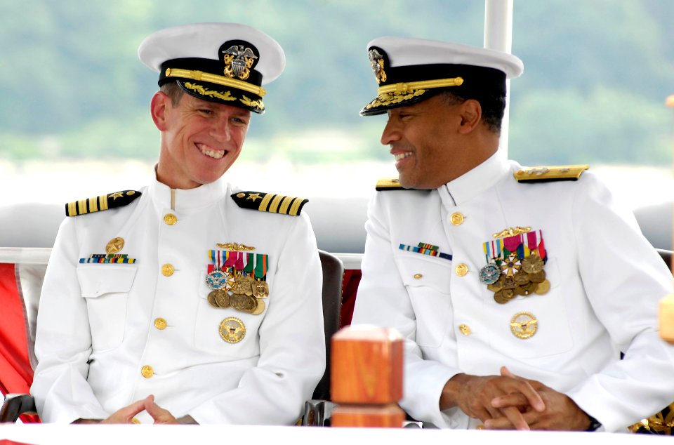 US Navy 080627-N-8467N-001 Rear Adm. Bruce E. Grooms, commander, Submarine Group 2, and Capt. Richard P. Breckenridge, commander, Submarine Squadron 4, share a laugh