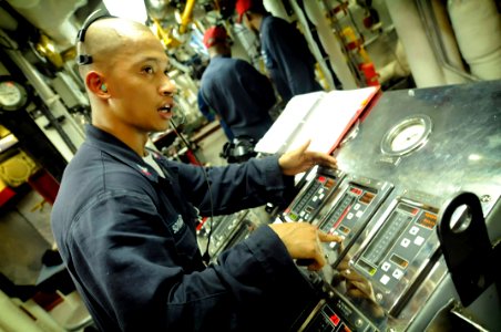US Navy 080629-N-8546L-066 Amphibious command ship USS Blue Ridge (LCC 19) Machinist Mate 2nd Class Rogelio Soriano Jr. mans the Boiler Technician of the Watch console
