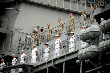 US Navy 080627-N-6674H-020 Sailors and Marines man the rails as the amphibious assault ship USS Bonhomme Richard (LHD 6) arrives at Naval Station Pearl Harbor for a scheduled port call before participating in Rim of the Pacific