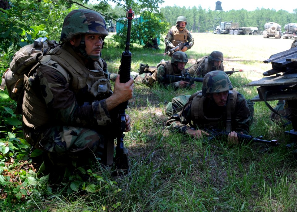 US Navy 080627-N-1120L-016 Quick response force members assigned to Naval Mobile Construction Battalion (NMCB) 7 stand by to respond to a simulated demonstration