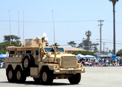US Navy 080628-N-8547M-154 Members of Naval Mobile Construction Battalion (NMCB) 4 convoy security team perform a firepower demonstration for the guest of the Seabee Day's parade