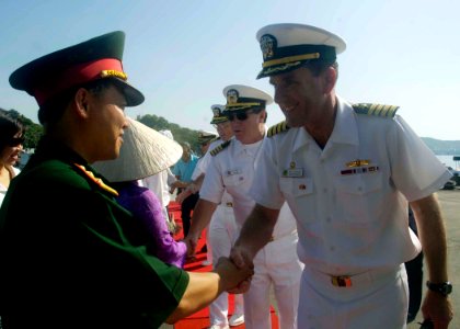 US Navy 080629-N-0209M-001 Capt. William Kearns, mission commander, Pacific Partnership 2008, greets a Vietnamese official at a closing ceremony that marked the Military Sealift Command hospital ship USNS Mercy's (T-AH 19) depa
