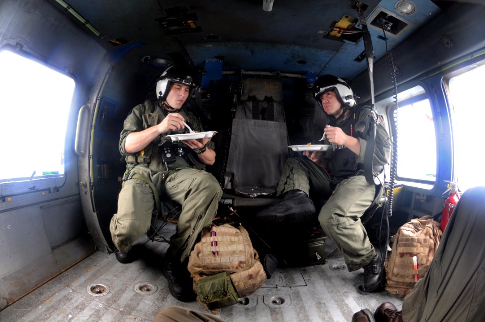 US Navy 080629-N-5961C-015 Air crews assigned to Helicopter Anti-Submarine Squadron (HS) 4 have been working long hours for five days delivering food and water to Panay Island, Republic of the Philippines in the wake of Typhoon