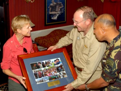 US Navy 080629-N-7730P-014 U.S. Ambassador to the Philippines, Kristie A. Kenney is presented with a collection of photos depicting relief efforts by USS Ronald Reagan (CVN 76), and other ships in her group, in the wake of Typh