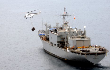 US Navy 080629-N-5961C-008 Super PUMA helicopters fly much needed bottled water to Kalibo, Republic of the Philippines from the deck of the Military Sealift Command combat stores ship USNS Niagara Falls (T-AFS 3)