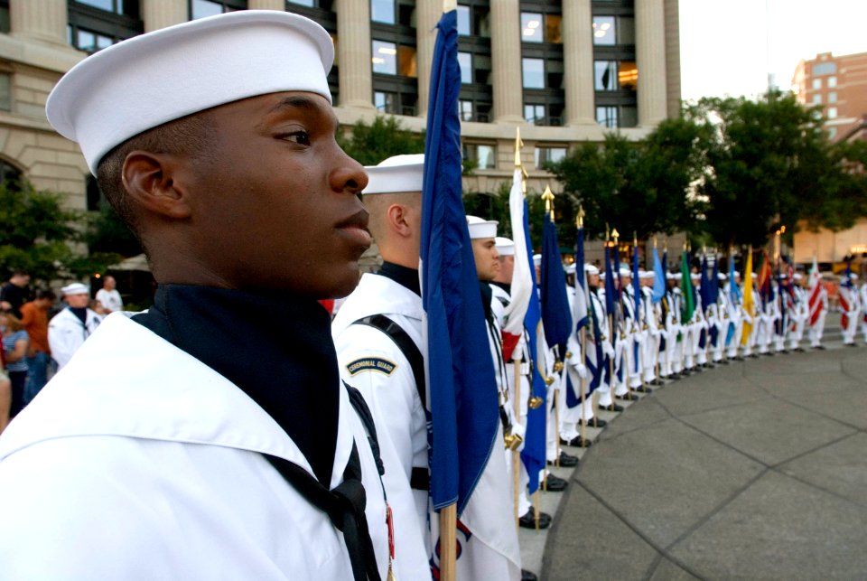 US Navy 080701-N-8273J-078 Sailors assigned to the Navy Ceremonial Guard hold flags representing each state during the presentation of colors during a Navy District Washington Concert on the Avenue at the U.S. Navy Memorial Pla
