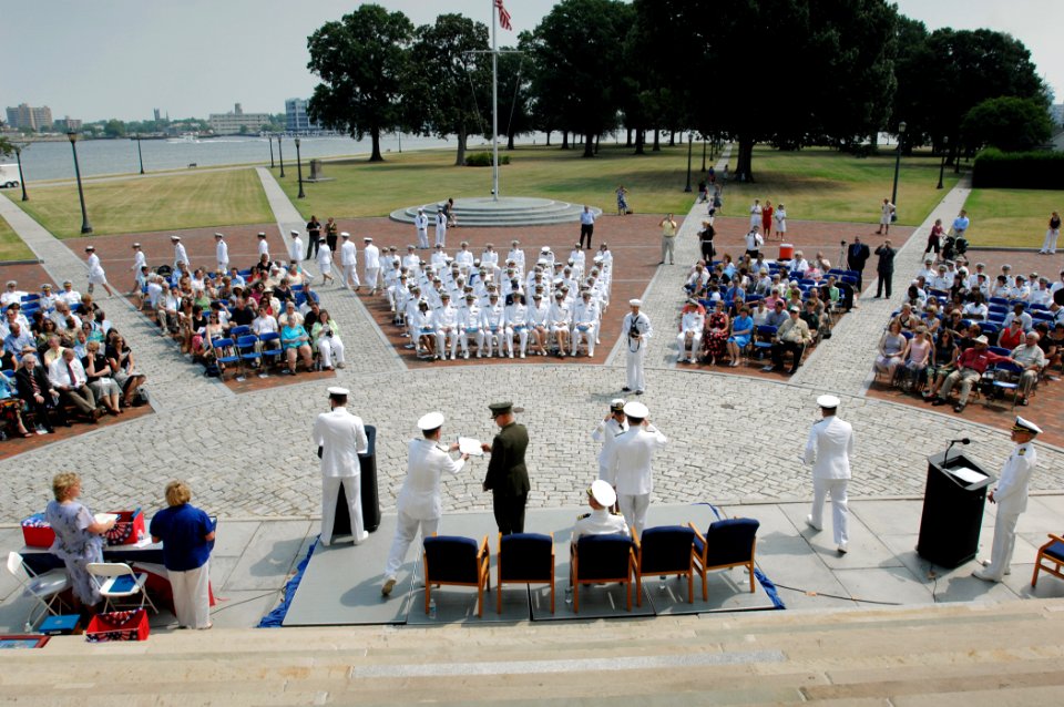 US Navy 080627-N-8148A-202 Lt. Cmdr. Christopher Miller, left, reads off the names of the graduates alphabetically during the Naval Medical Center Portsmouth intern class of 2008 graduation ceremony