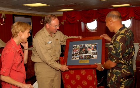 US Navy 080629-N-7730P-016 Armed Forces of the Philippines, Chief of Staff, General Alexander B. Yano of the Philippines Army presented with a collection of photos depicting relief efforts by USS Ronald Reagan (CVN 76)