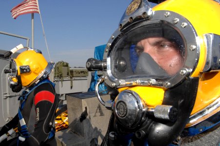 US Navy 080630-N-8298P-157 Mass Communication Specialist 1st Class Eric Lippmann, assigned to Naval Expeditionary Combat Command Det. Combat Camera Underwater Photo Team, prepares to dive to conduct salvage operations