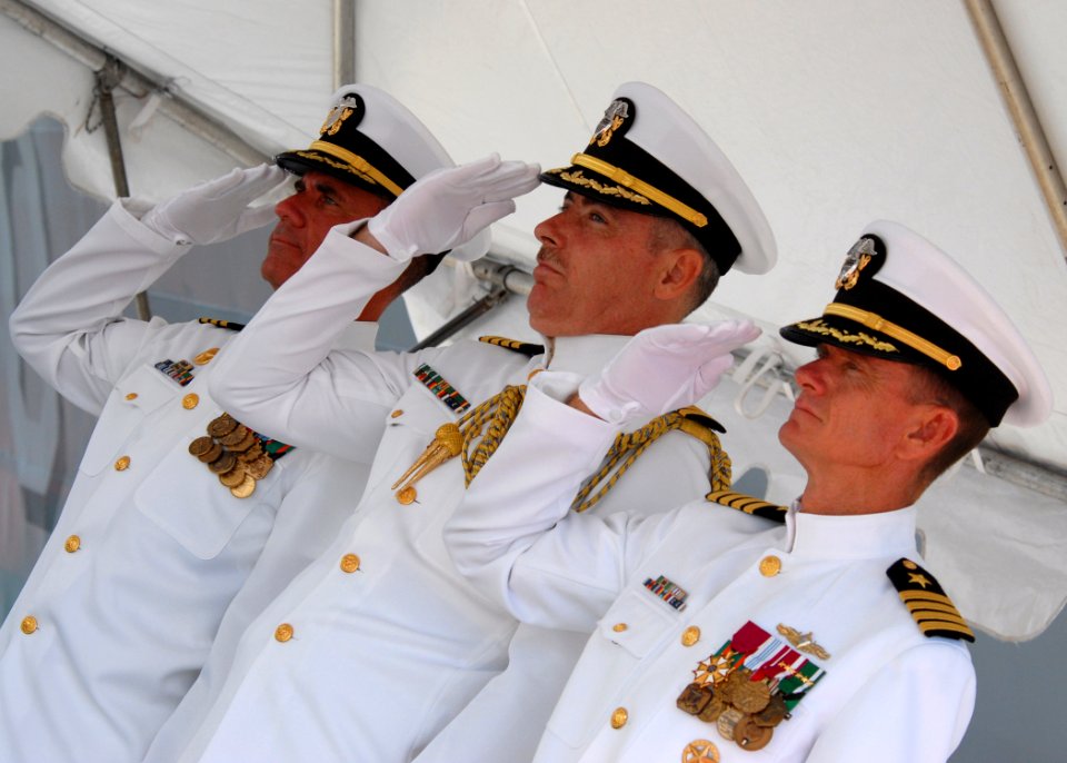 US Navy 080703-N-4965F-188 Sailors render honors for colors during a pier side change of command ceremony at Naval Station Pearl Harbor