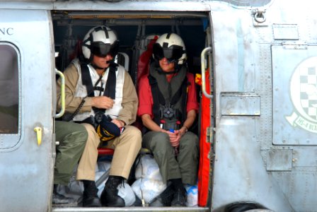 US Navy 080629-N-0640K-227 Commander Carrier Strike Group Seven, Rear Adm. James P. Wisecup and U.S. Ambassador to the Philippines, Kristie A. Kenney, prepare to take a helicopter ride in and HH-60H Seahawk