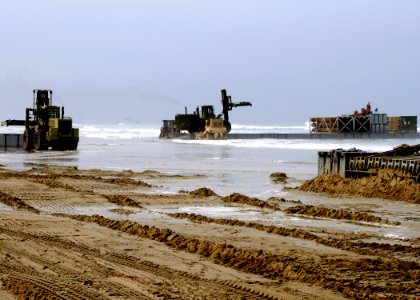 US Navy 080708-N-1424C-229 A Navy lighterage system causeway ferry is off loaded during Joint Logistics Over-The-Shore (JLOTS) 2008