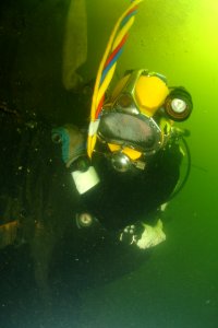 US Navy 080707-N-8298P-021 Army Staff Sgt. Joshua West lowers himself down to the sunken former Soviet submarine Juliett 484 to conduct salvage operations