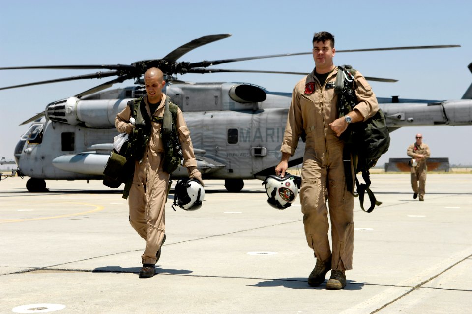 US Navy 080701-F-5735S-058 Marines assigned to Marine Heavy Helicopter Squadron (HMH) 465 walk away from a CH-53 Super Stallion helicopter at Naval Air Station (NAS) Lemoore