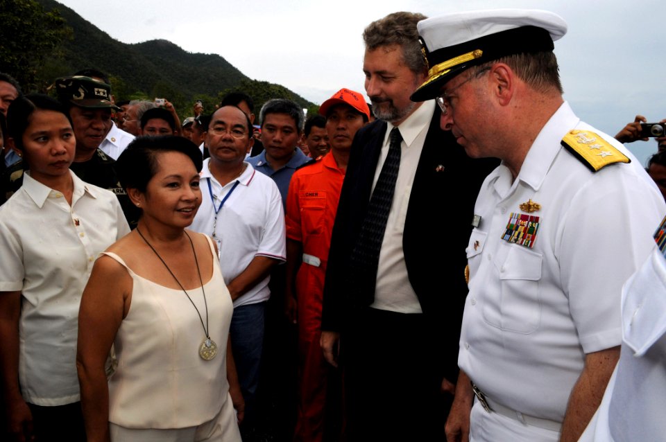 US Navy 080701-N-3659B-373 Rear Adm. James P. Wisecup, commander of the Ronald Reagan Carrier Strike Group, speaks with Philippines President Gloria Macapagal-Arroyo