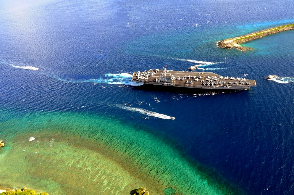 US Navy 080706-N-5961C-002 The aircraft carrier USS Ronald Reagan (CVN 76) and Carrier Air Wing 14 (CVW 14) begin their transit into Agana Harbor for a port call on Guam after working off the coast of the Philippines in the wake
