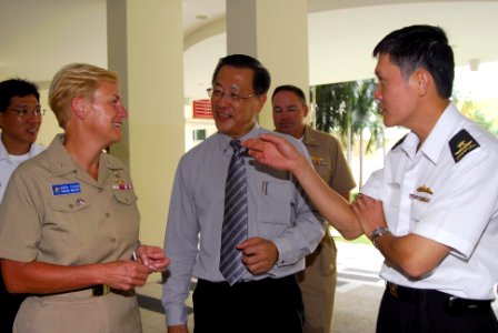 US Navy 080701-N-7095C-013 Rear Adm. Nora W. Tyson, left, commander of Logistics Group Western Pacific, Lim Yeon Khee, and Ng Chee Peng talk during a visit to MINDS for a community relations project