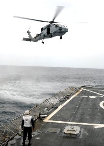 US Navy 080709-N-1082Z-059 Boatswain's Mate 1st Class Stephen Graham serves as flight deck safety observer