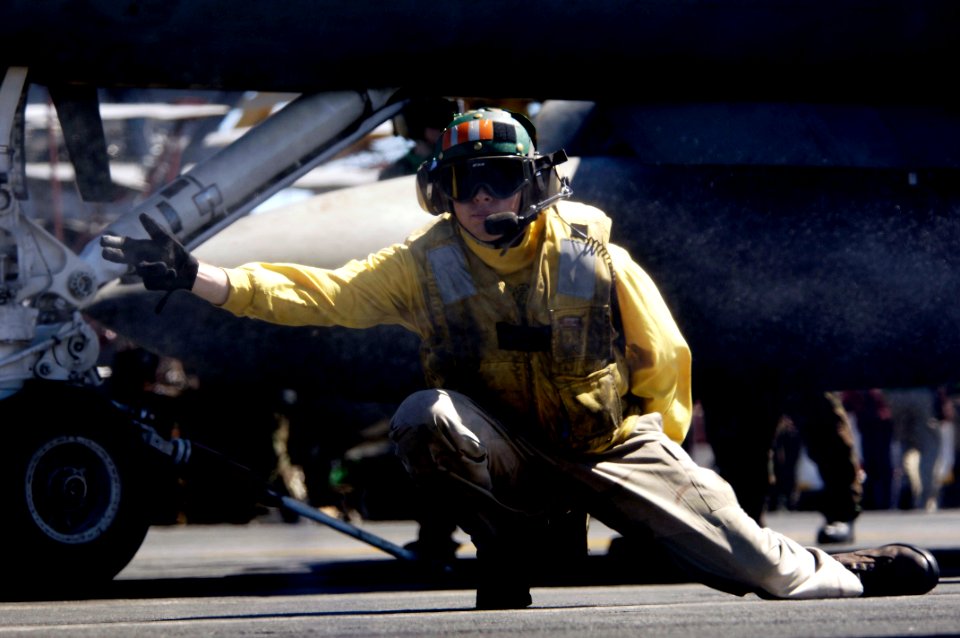 US Navy 080708-N-7883G-012 Lt. James McDonald, an aircraft shooter, launches an F-A-18F Super Hornet assigned to Strike Fighter Squadron (VFA) 102 from the aircraft carrier USS Kitty Hawk (CV 63)