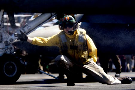 US Navy 080708-N-7883G-012 Lt. James McDonald, an aircraft shooter, launches an F-A-18F Super Hornet assigned to Strike Fighter Squadron (VFA) 102 from the aircraft carrier USS Kitty Hawk (CV 63)