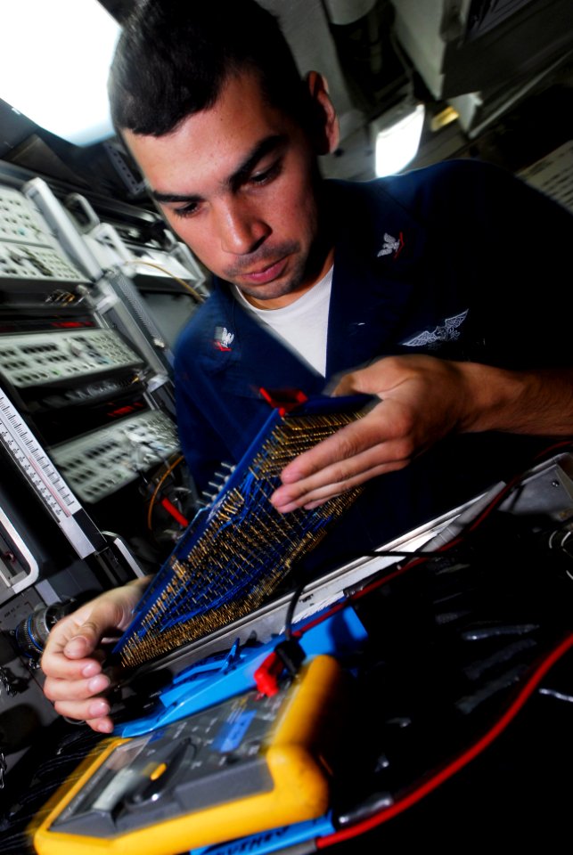 US Navy 080711-N-3946H-013 Aviation Electronics Technician 3rd Class Justin Gonzalez, of San Antonio, Texas, troubleshoots the radar system of an EA-6B Prowler assigned to Electronic Attack Squadron (VAQ) 136
