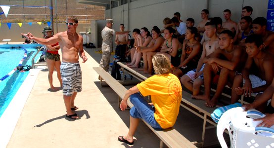 US Navy 080711-N-4965F-074 Navy Diver 1st Class Jeff Nodine, assigned to Pearl Harbor Naval Shipyard (PHNSY) Regional Dive Locker, provides instruction to a group of Navy Junior Reserve Officer Training Corps (NJROTC) cadets photo