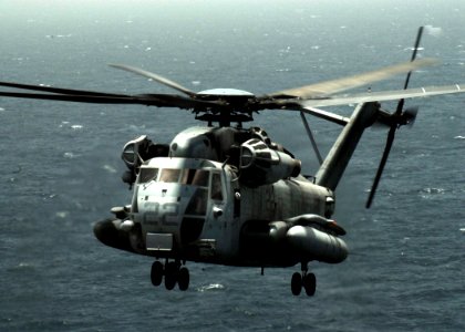 US Navy 080710-N-5148B-031 A CH-53E Super Stallion helicopter assigned to Marine Medium Helicopter Squadron (HMM) 165 prepares to land on the flight deck of the amphibious assault ship USS Peleliu (LHA 5) photo