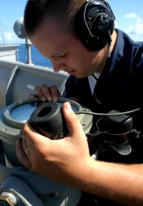 US Navy 080705-N-3316L-128 Boatswain's Mate Seaman Joshua Brumfield stands the lookout watch aboard the amphibious transport dock ship USS Nashville (LPD 13) during a transit across the Atlantic Ocean