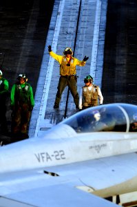 US Navy 080711-N-3659B-038 An Aviation Boatswain's Mate (Handling) directs an F-A-18F Super Hornet assigned to the